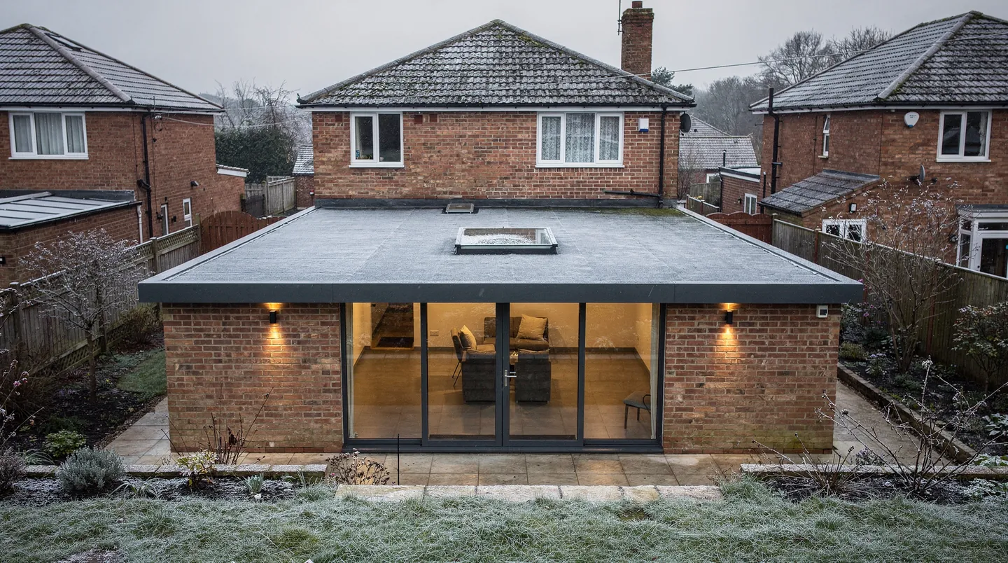 A flat rooflight on an extension roof, with frost on the roof and clear glass